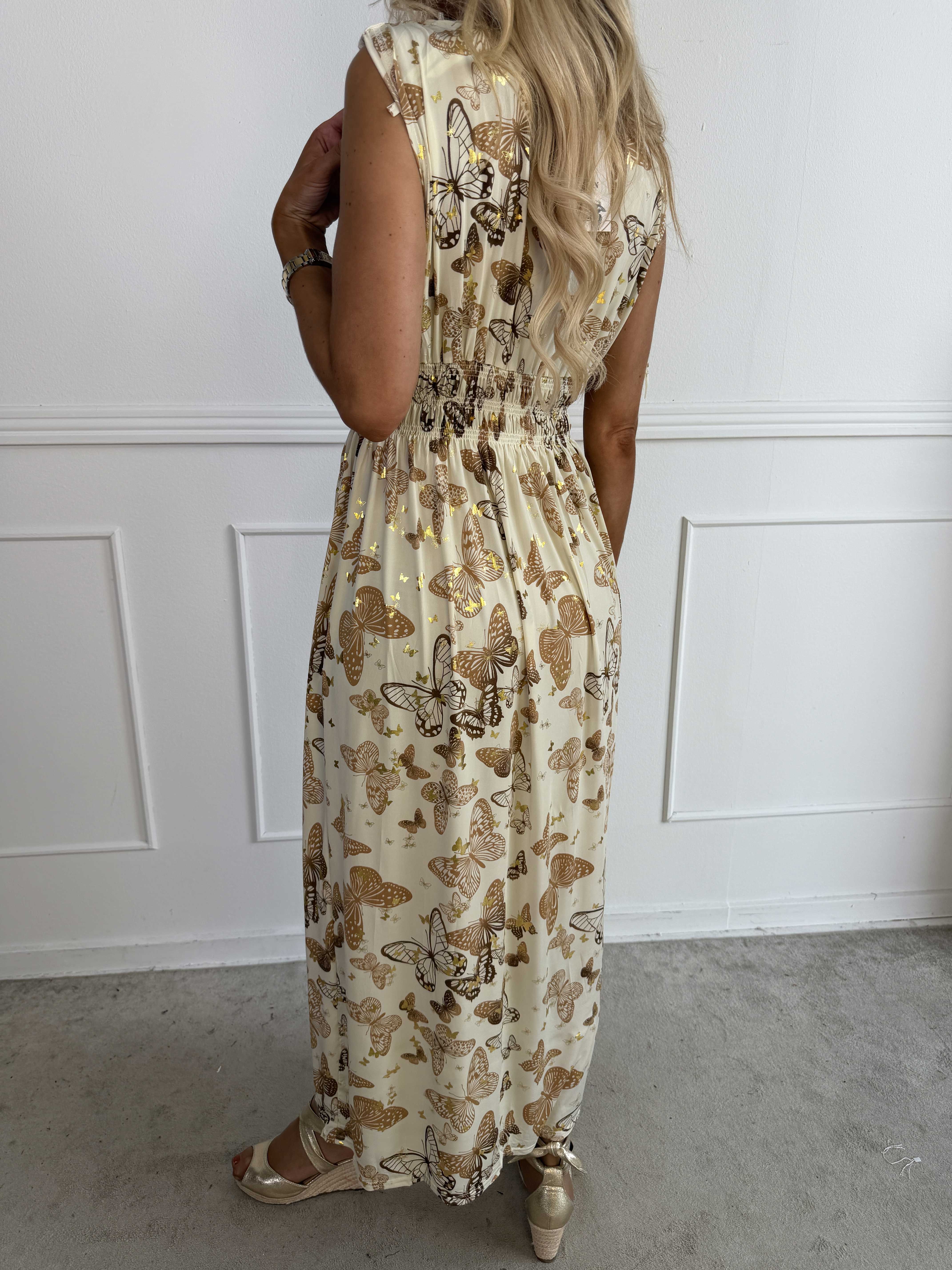 Pams Butterfly Sleeveless - A long, stretchy dress with a butterfly print and gold details