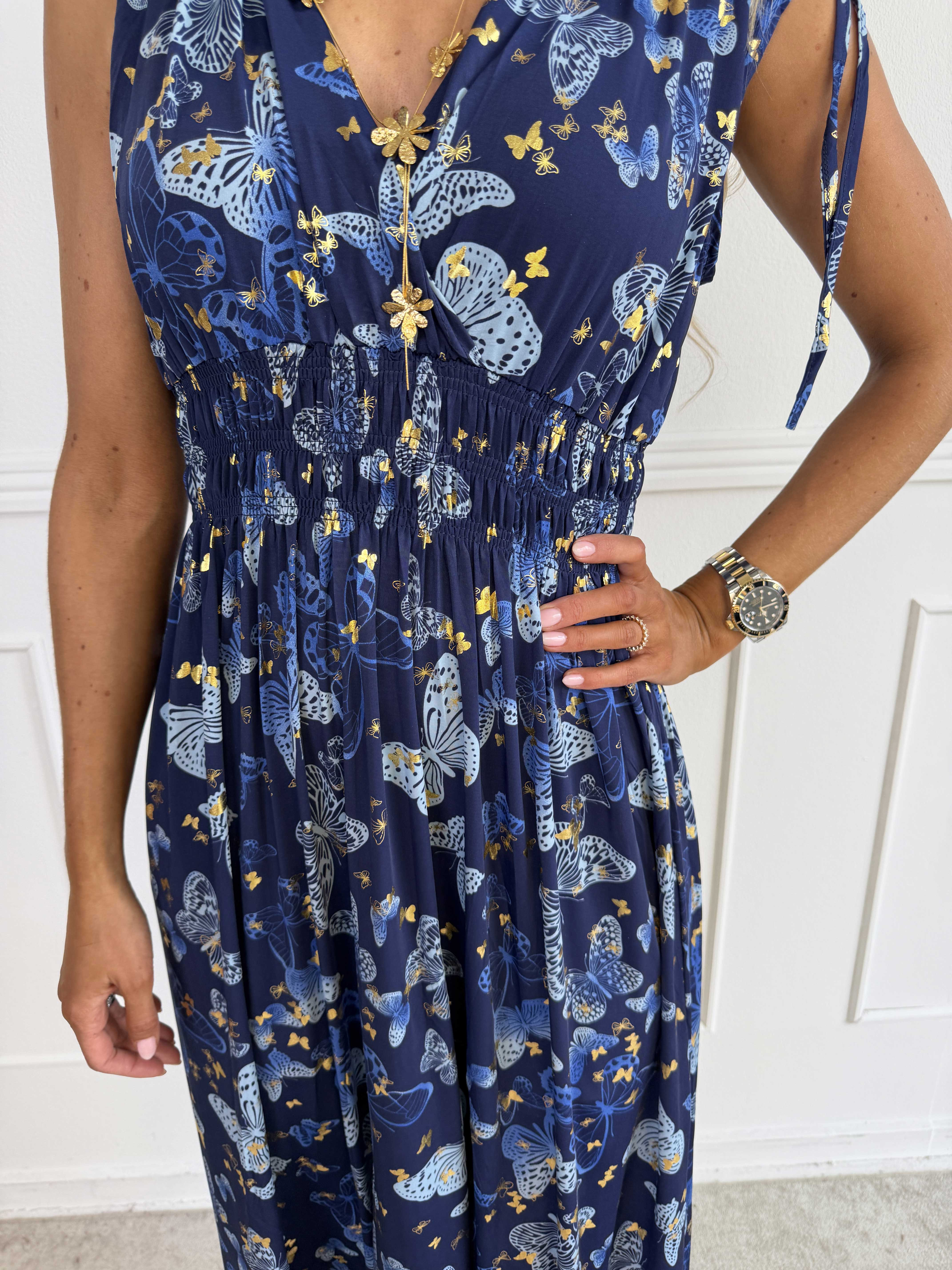 Pams Butterfly Sleeveless - A long, stretchy dress with a butterfly print and gold details