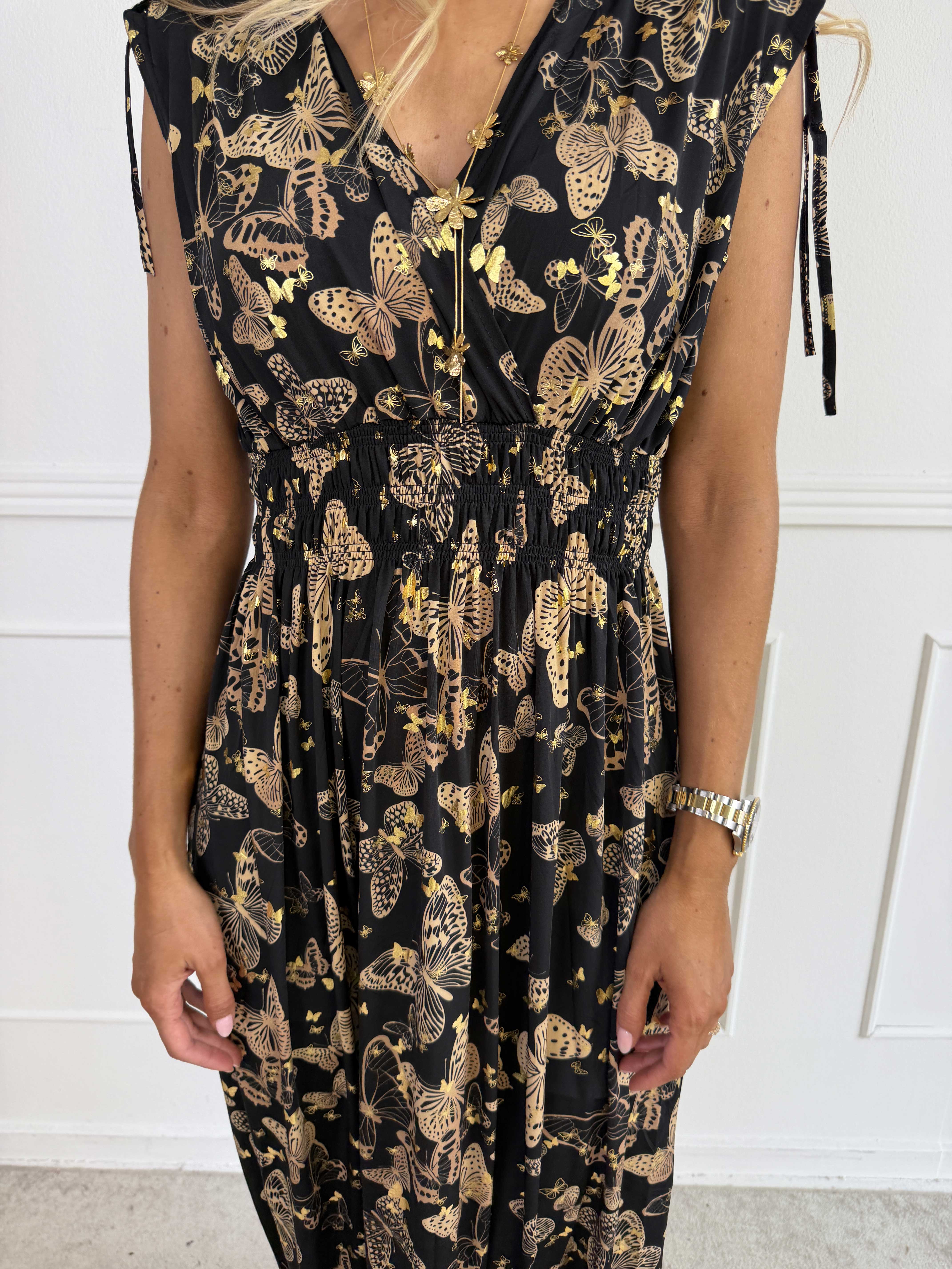 Pams Butterfly Sleeveless - A long, stretchy dress with a butterfly print and gold details