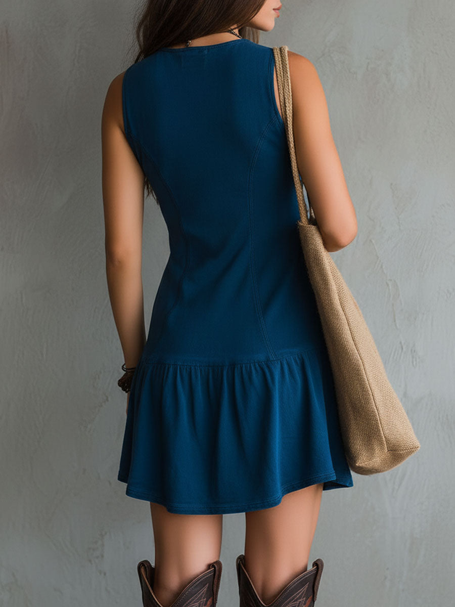 Bohemian indigo mini dress with a V-neck, button closure, and sleeveless design